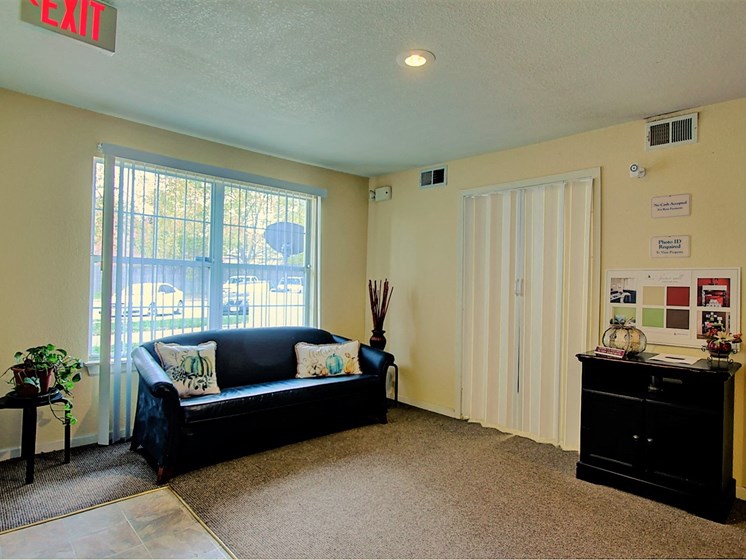 Image of carpeted room with furniture and window